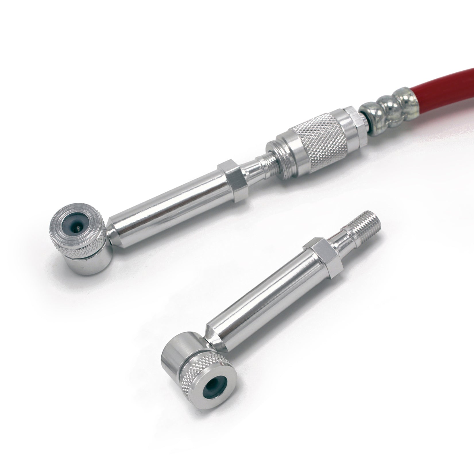 The Prestacycle Disc Wheel Mini Presta Head, by Prestacycle, is displayed on a white background with two silver metal valve stem extensions—one attached to a red hose and one detached—alongside a Presta valve adapter.