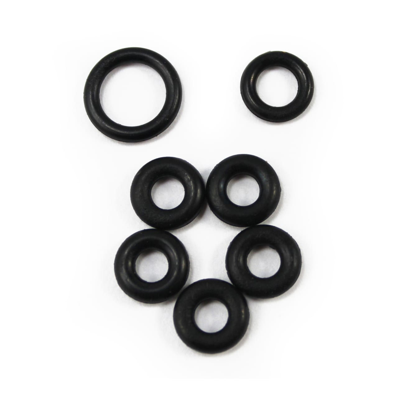 Seven black rubber O-rings from the Prestacycle Prestaflator Spin Head Rebuild Kit are arranged on a white background—two on top, five below—making them perfect as spare parts for your Prestaflator.