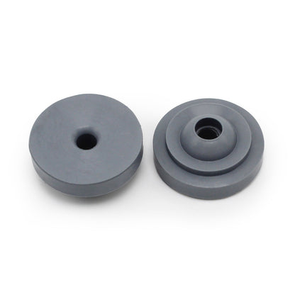 Two round, gray Prestaflator Big Presta Head Gaskets from Prestacycle—perfect Presta Head replacements—include one with a single hole and another with a stepped design, both displayed on a white background.