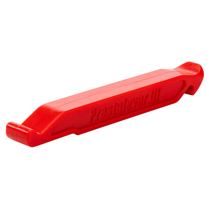 The Prestacycle Prestalever GO is a red plastic multi-tool tire lever with 5 functions, including angled ends for prying tires and a built-in Presta valve core tool.