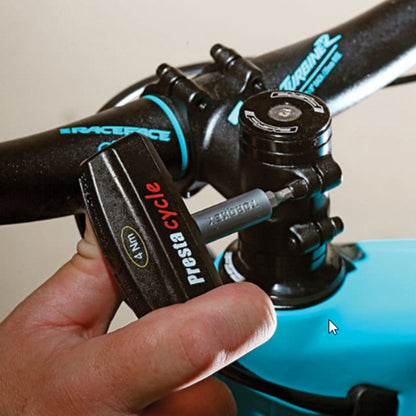 A hand uses a Prestacycle Pro TorqKeys 8Nm T-Handle Torque-Limiting Bits Tool to tighten a bolt on a black and blue bicycle’s handlebar stem. The ergonomic tool safely ensures proper torque as specified by Prestacycle.