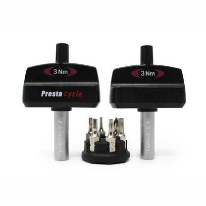 The Prestacycle Mini TorqKeys 3Nm Preset Torque Tool stands upright beside a compact holder displaying six nickel-plated S2 steel bits, all from Prestacycle.
