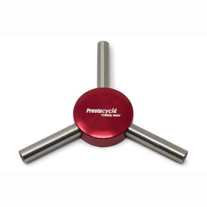 The Prestacycle Three Way Y Bits Tool by Prestacycle features three metal handles extending from a central red hub in a Y-shape, shown on a white background.
