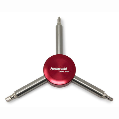 The Prestacycle Three Way Y Bits Tool features heavy-duty metal arms, each with a different replaceable bit in a Y-shaped design, shown here in red on a white background.