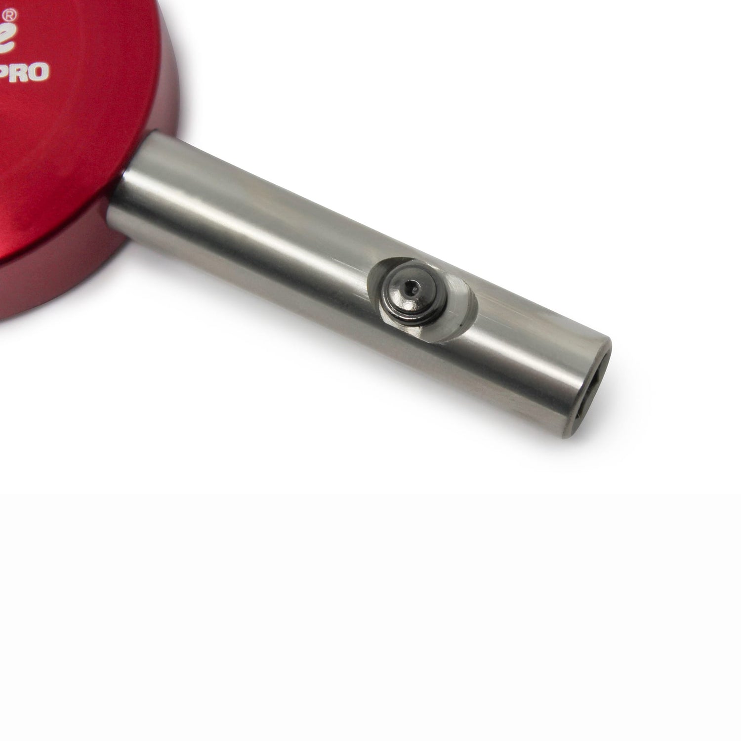 A close-up of the Prestacycle Professional Three Way Y Bits Tool Kit—a metallic cylindrical tool for 1/4″ Hex bits—by Prestacycle, shown attached to a red component and isolated on a white background.