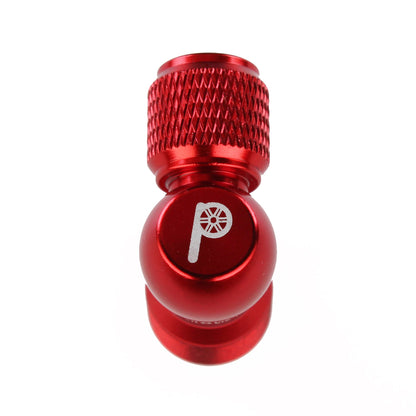The Prestacycle Prestaflator Micro Bundle features a red metal valve cap with textured grip and a white tire and pump icon, compatible with Presta Schrader systems, shown on a white background.