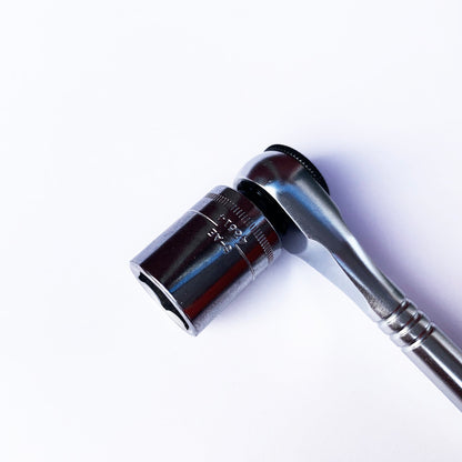 A close-up of the Prestacycle Professional Low-Profile 1/4 Hex to 1/4 Square Socket Adapter by Prestacycle, shown with a silver ratchet wrench and socket against a plain white background.