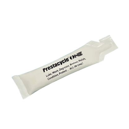 A single-use packet of Prestacycle One Liquid by Prestacycle, displaying USDA Certified Bio-Based and ASTM International logos, offers all-in-one lube, wash, degrease, restore, polish, condition, and protect on a plain white background.