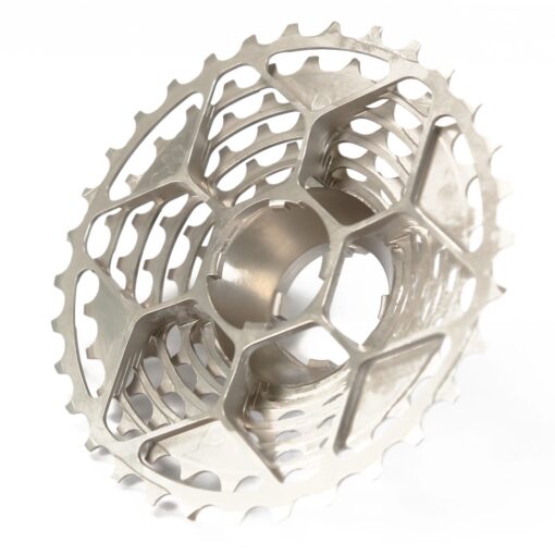 The Prestacycle UniBlock PRO Cassette (12 Speed) by Prestacycle features a metallic, hollow, lightweight design with a lattice structure and multiple sprockets for high performance and reduced weight.