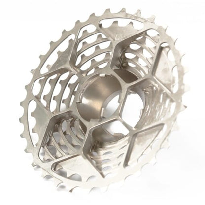 The Prestacycle UniBlock PRO Cassette (12 Speed) by Prestacycle features a metallic, hollow, lightweight design with a lattice structure and multiple sprockets for high performance and reduced weight.