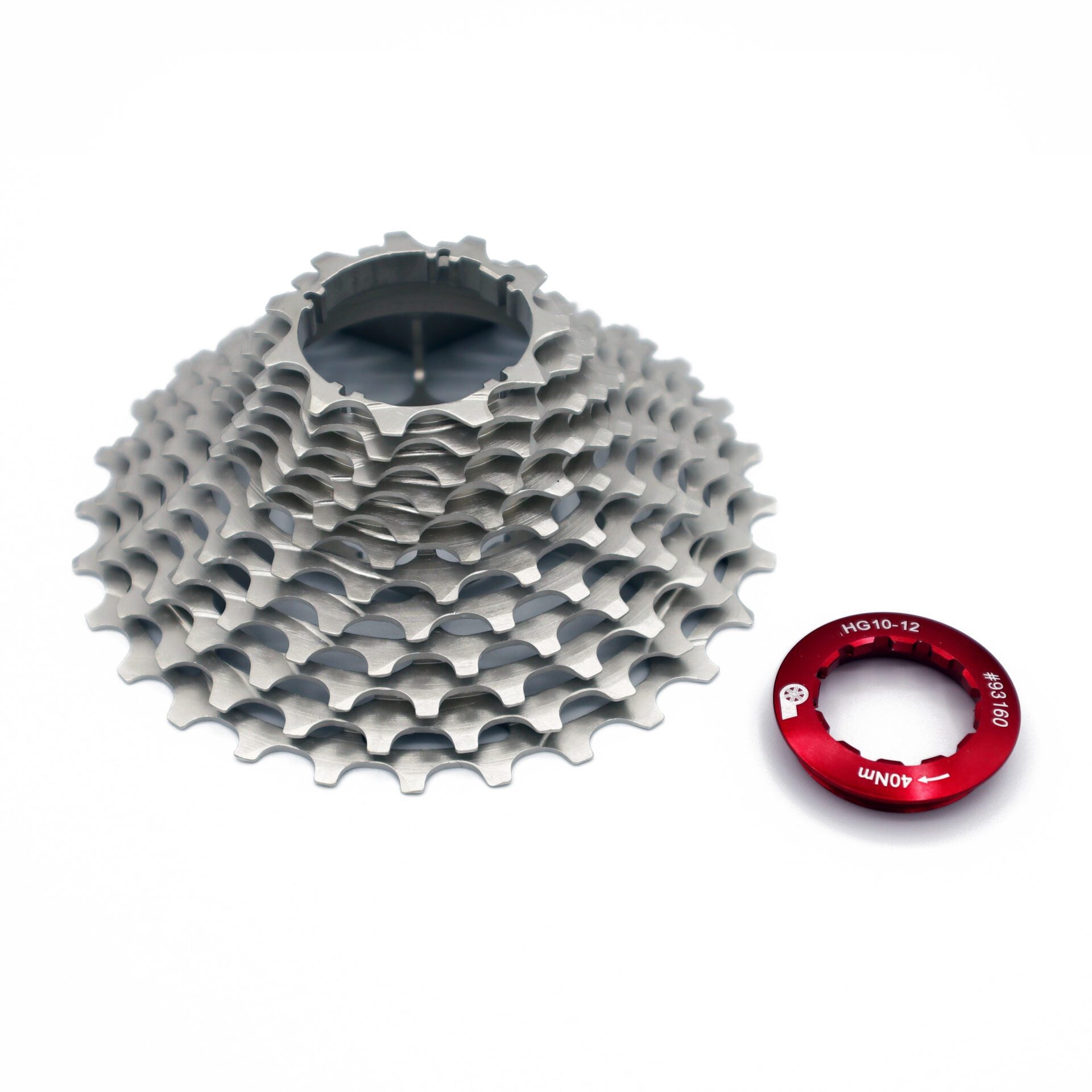 A silver Prestacycle UniBlock PRO 12-speed cassette made of durable ChroMoly steel sits beside a red MG10-12 11T 50N.m lockring on a white background, compatible with Shimano HG12 systems.